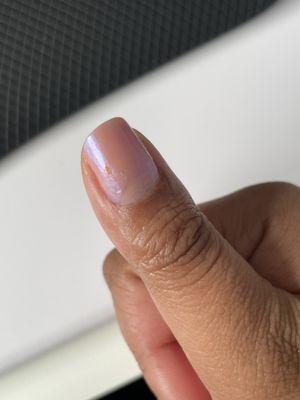 Freshly finished manicure with a crack in the paint