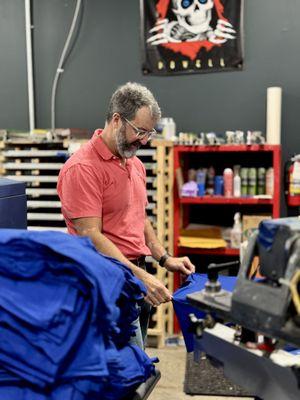 Man at work, screen printing Concord NC