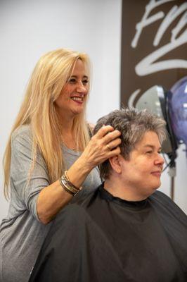 Our lively stylist Gayle finishing up a short women's haircut