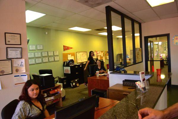 Office staff answer customers questions