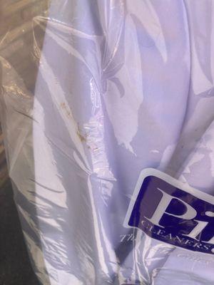 Stain on left hand side of suit.