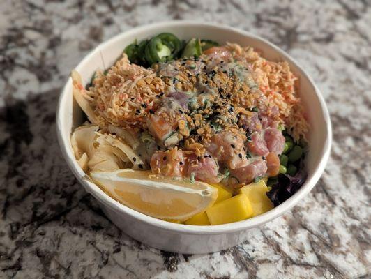 Create your own poke bowl! Half greens half brown rice, edamame, two scoops spicy crab, mango, jalapenos, cucumber, ginger, tuna and salmon!