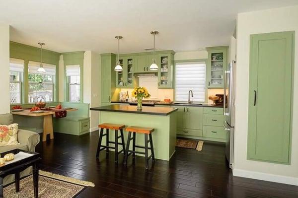 Shaker cabinets with custom color, leather finished black granite, with engineered distressed hardwood floors