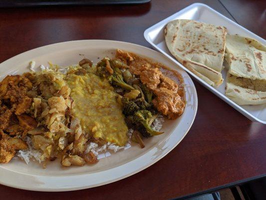 Cabbage aloo, daal, veggie, and two kinds of chicken curry. And of course naan to wipe the plate clean!