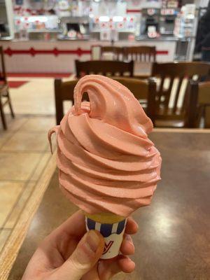 Raspberry soft serve in a cone