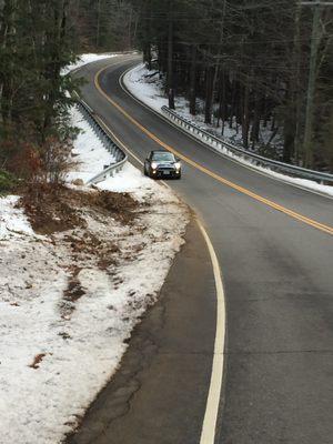 Ditch on steep slope where my car landed during the snow storm the night before