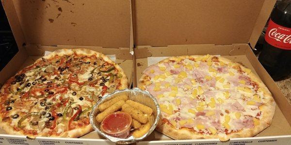 Vegetable pizza on the left, mozzarella sticks in the middle, Hawaiian pizza on the right, and it all came with a free coca cola!