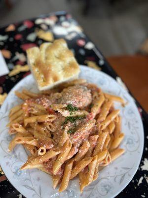 "The Shari" penne with crack sauce, two pork meatballs and fresh focaccia