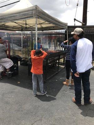 People waiting for their pollo asado and carne asada!!!