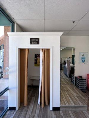 Available fitting room for tailoring fittings.