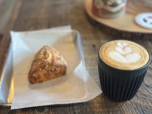 Cappuccino with a cinnamon scone.