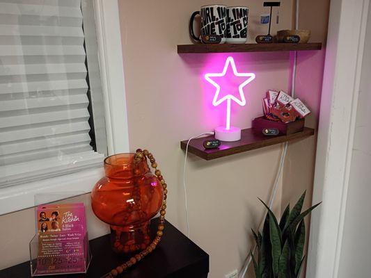 Some merch for sale like socks, earrings, and mugs