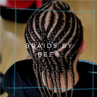 Mens Design corn row braids with natural hair.