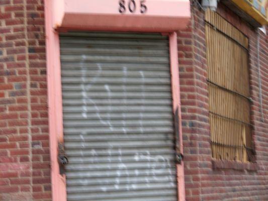 Some very racist graffiti on the door at this business.