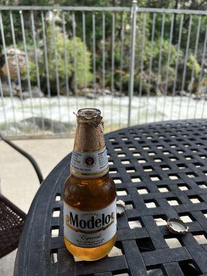 Sitting on the back porch enjoying the sounds and a beer.