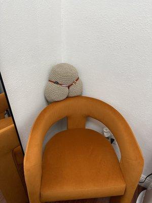 Her lttle seat is the corner