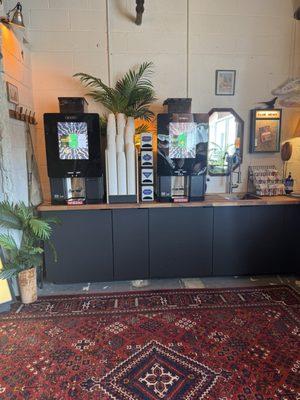 Two coffee machines with three options for coffee