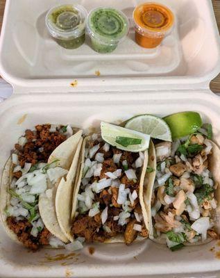 Adobada (marinated pork), chorizo, and chicken tacos all served on corn tortillas