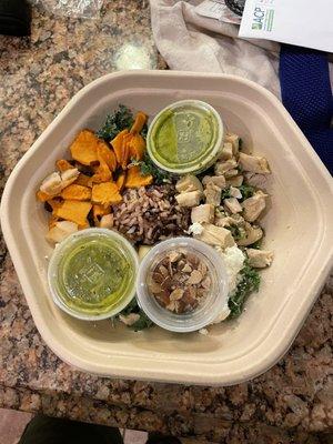 An untouched salad, half full