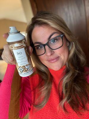 Owner Erin Korinek displaying her personal favorite product from R+Co