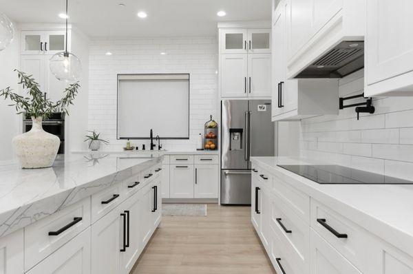 Jennair induction cooktop, Jennair counter depth fridge, Jennair microwave and oven combo on the left