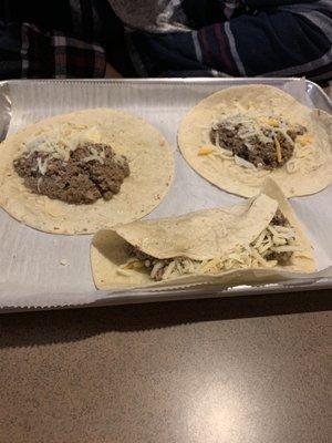 Ground beef tacos, just meat and cheese