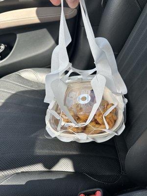 To go bowl in decorative bag
