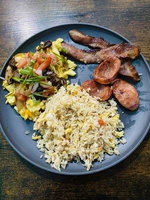 Scramble local eggs with mushrooms & garnish, garlic fried rice, bacon and Portuguese Sausage.