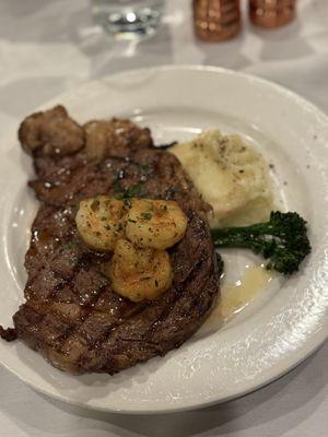 Surf and turf special with mashed potatoes and broccolini.