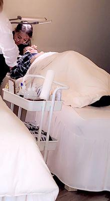 My wife in the process of getting lashes done.