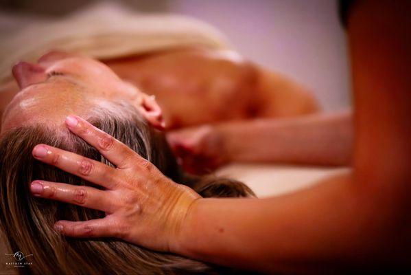 Jessica Oliveira LMT giving a client a neck massage