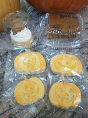 Seasonal treats. GF pumpkin bread, GF caramel biscoff cupcake, and sugar cookies decorated as pumpkins.