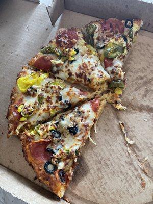 Pizza with pepperoni, jalapeño & banana peppers, olives, onions with extra cheese.