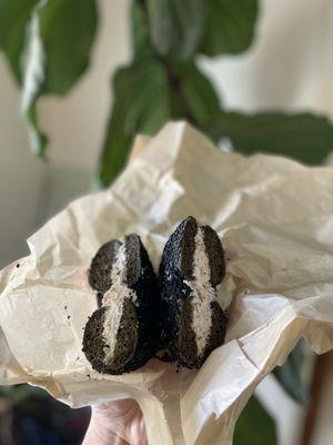 black sesame and harissa bagel with red onion and caper spread