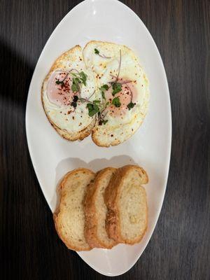 This is a sunny side up eggs with bread it is delicious
