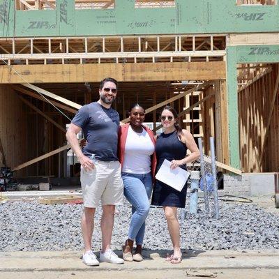 My partner and I with Michelle of The Pearl Team at the construction site of our new home.