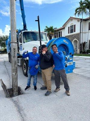 Cleaning catch basins to prevent flooding.