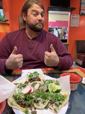 A happy steak taco eater