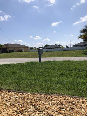 Tall grass needs mowing.This company will not schedule until next week. While paying 12 Stones to maintain this.