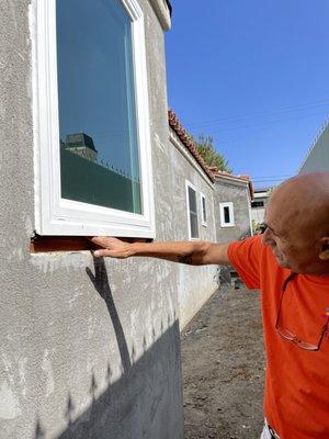 NEW WINDOW- you can fit your hand under the window. big gap. many windows like this