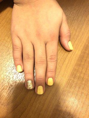 Gel manicure and golden glitter.