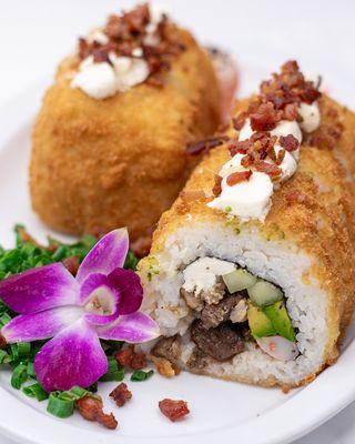 Shareable extra big roll with rice, seaweed, cream cheese, avocado, cucumber. Options: Steak, shrimp, tampico, chicken. Topped with cream ch