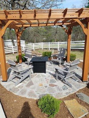 Flagstone seating area with wood pergola.