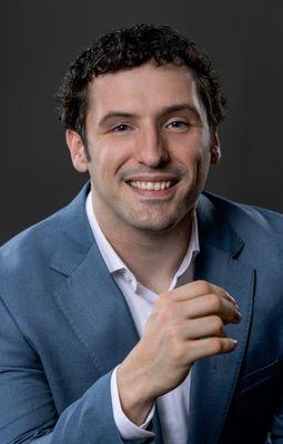 Professional headshot taken in studio in Fayetteville, Arkansas.