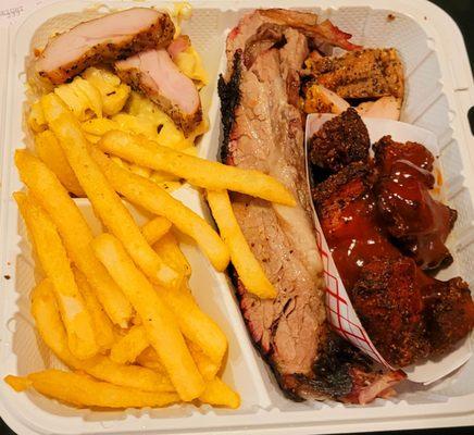3 meat plate with brisket, burnt ends, chicken, mac and cheese and fries.