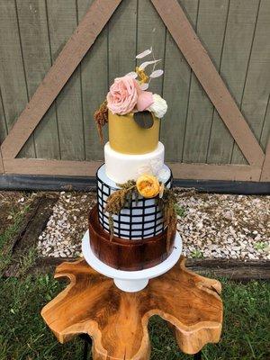 4-tiered wedding cake with fresh floral