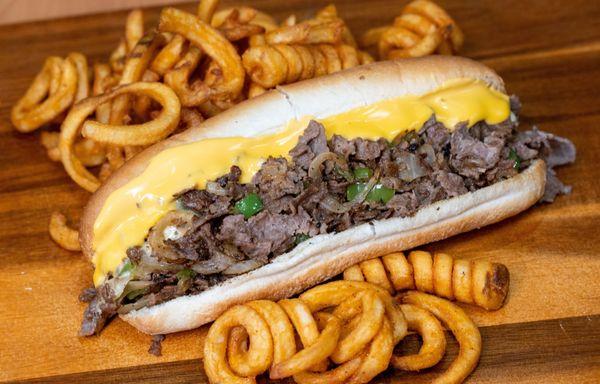 Best Cheesesteak! Sam's Cheesesteak with Sauteed Onions & Green Peppers, with chopped ribeye steak, lots of cheese!