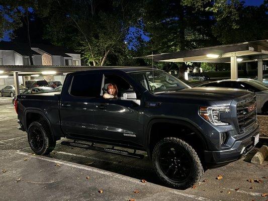 Truck lifted and tires with level kit.