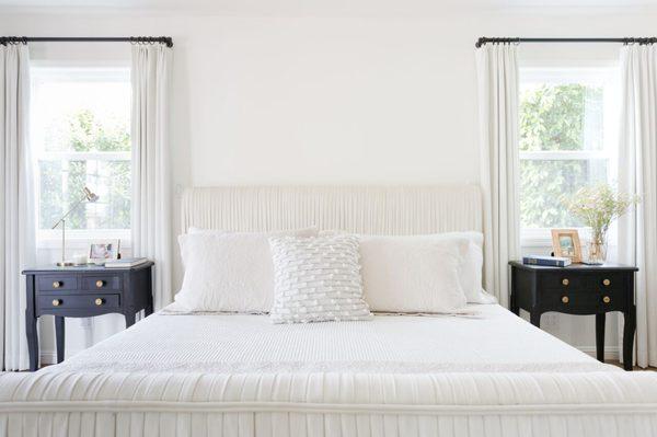 Custom bed with hand pleated detail.