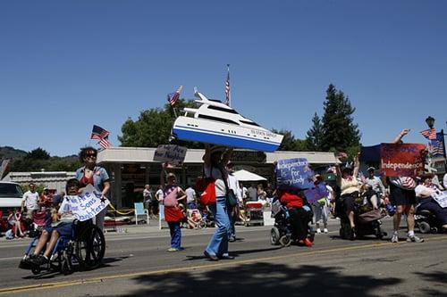 Advocating in an Independence Day parade. We provide services and advocate in the community so people can remain independent.